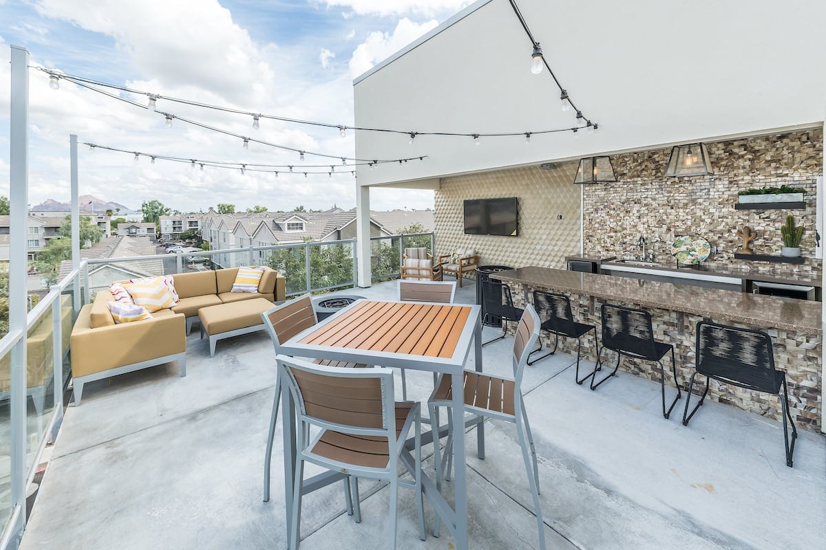 Phoenix, AZ Apartments for Rent - Vela on Camelback Sky Deck with Hanging Lights and Bar Kitchen